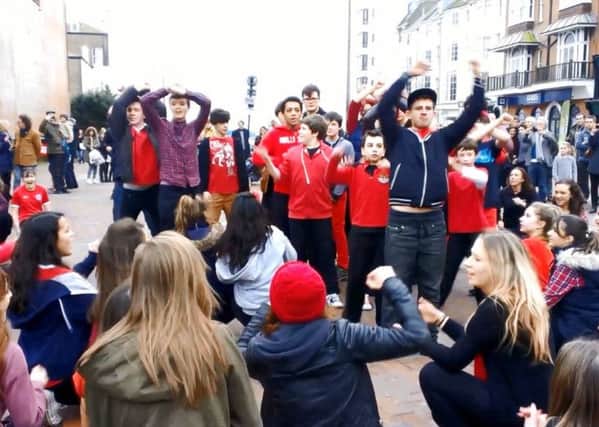 Students from Steyning Ariel Drama Academy break out into a flash mob in Worthing town centre