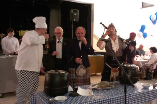 Toasting the haggis, left to right, chef Duncan Walkman, organiser Geoff Howitt, reader Douglas Hill and piper Tim Wilkinson