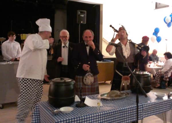 Toasting the haggis, left to right, chef Duncan Walkman, organiser Geoff Howitt, reader Douglas Hill and piper Tim Wilkinson