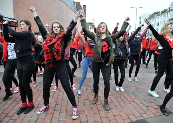 Ariel Drama Academys energetic flash mob in Worthing town centre            PICTURE: LIZ PEARCE W04226H14