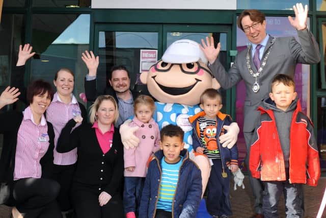 Rustington Parish Council chairman Andy Cooper with the children and nursery staff                L04262H14