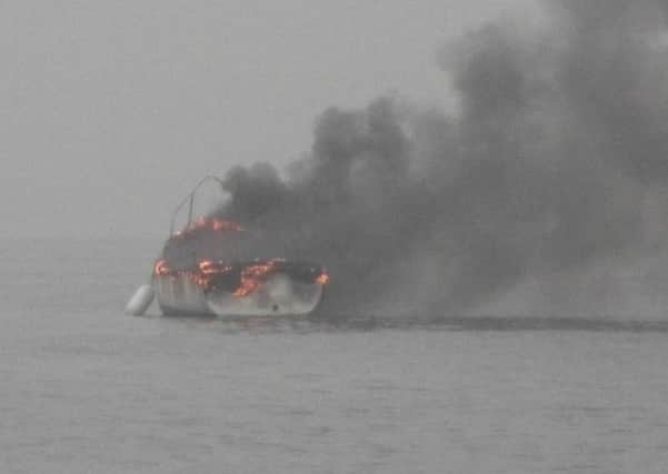 The moment lifeboat crews arrived at a boat blaze off the coast of Littlehampton           PHOTO: RNLI