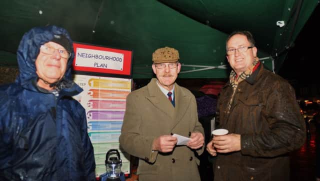 Ray Osgood (centre) at a stand explaining the neighbourhood plan, photo by Mike Beardall, Oakland Media