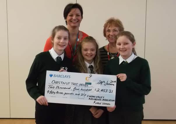 Students from the Vale First and Middle School with a cheque for Chestnut Tree House