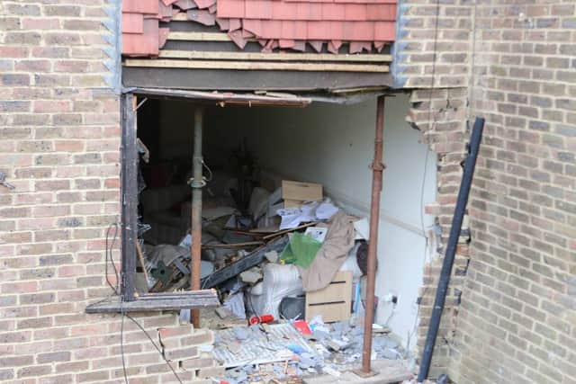 The aftermath of the collision which saw a car plough through this wall and into the sitting room of this home