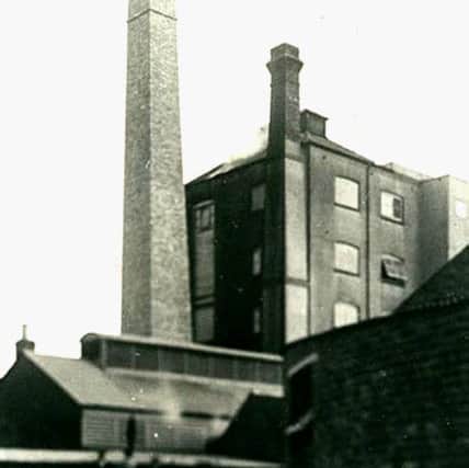 Constable's Swallow Brewery. with workmen on top of the chimney, circa 1900