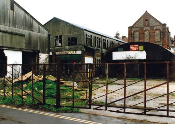 The disused Hago's metal work factory (just prior to redevelopment) on the site of the old Shipyard and Saw Mill. The old Neneveh chapel can be seen in the background