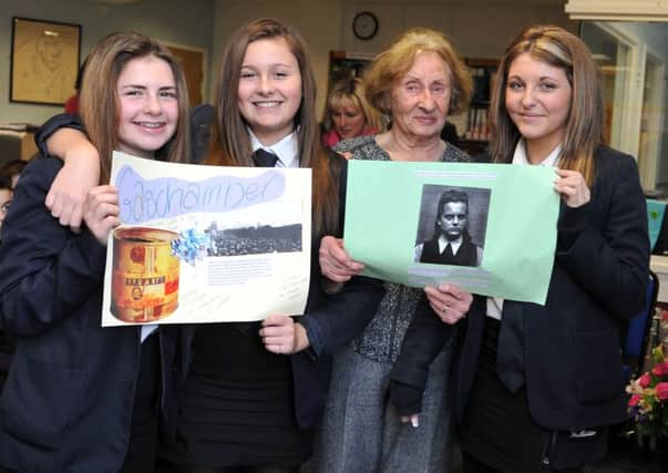 L-R Yasmin Moore (14), Megan Molloy (13) and Paige Elsdon (14) with Holocaust survivor Susan Pollack   L05251H14