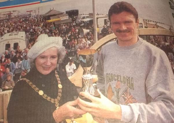 Eamonn Martin receives the winner's trophy from then town mayor June Fabian after winning the 1993 Hastings Half Marathon