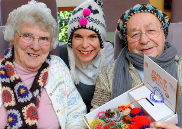 Bobble Day at Age UK Horsham in 2013. CEO Janice Leeming with Barbara Palmer and Ken Stafford. Photo by Derek Martin