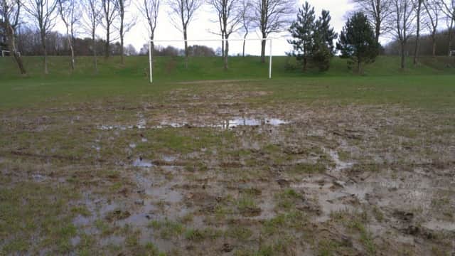 A waterlogged pitch at Tilekiln in St Leonards. Picture by Simon Newstead
