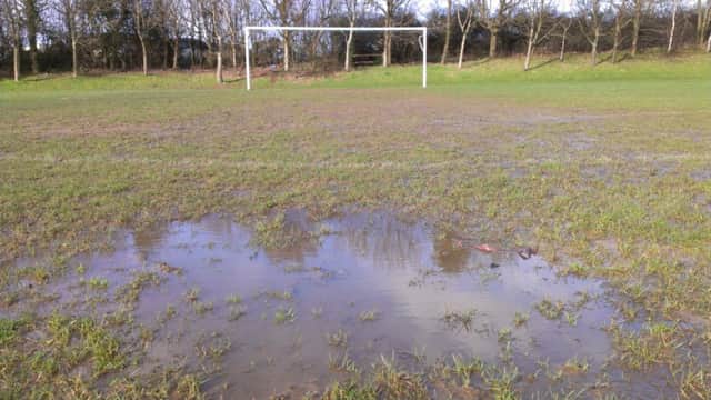 A waterlogged pitch at Tilekiln in St Leonards. Picture by Simon Newstead