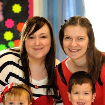 Steph Styles and her daughter Millie, Reka Choy and her son Jason at Hurstpierpoint Cottis playgroup in Methodist Church. The children have undergone heart surgery and the playgroup was raising funds for the BHF. Pic Steve Robards