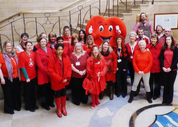 Council staff dress in red in aid of the British Heart Foundation