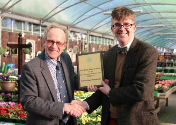 Tim Mason, who is currently the Chairman of the South Thames GCA group (right) presents Nigel Wait, Managing Director from Newbridge Nurseries with the Dick Allen Award for the countrys Most Improved Garden Centre 2013/2014.