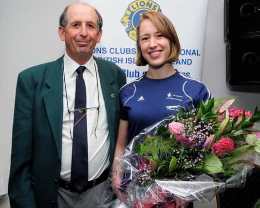 Olympic champion Lizzy Yarnold with Eric Hardwick at the 2012 Hastings Half Marathon prize-giving night. Picture by Tony Coombes Photography