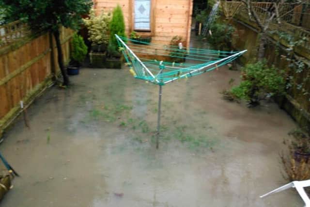 The sudden rush of water flooded Christina Angus' garden in Parklands Road, Hassocks