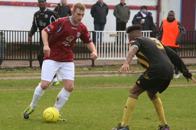 Sam Adams looks to take on an opponent during Hastings United's 2-2 draw with Merstham on Saturday. Picture by Terry S. Blackman