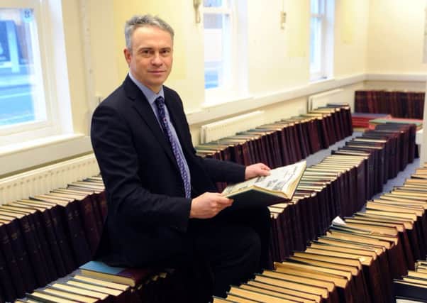 Editor-in-chief Gary Shipton looks through many years' worth of local news in our archives