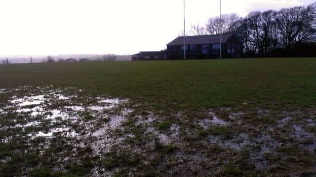 A waterlogged pitch at Hastings & Bexhill Rugby Club on Saturday. Picture by Simon Newstead