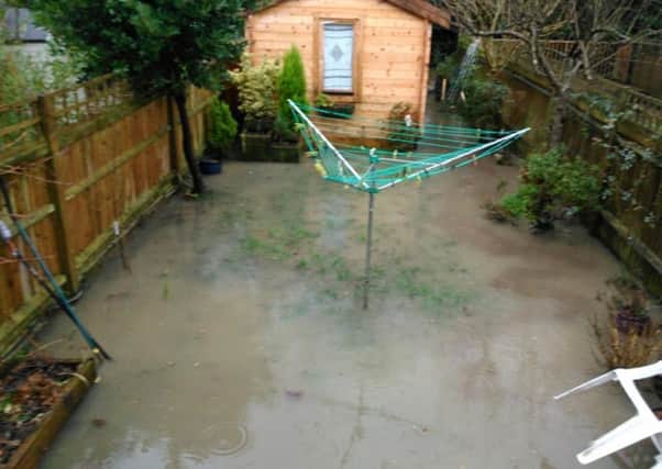 The sudden rush of water flooded Christina Angus' garden in Parklands Road, Hassocks