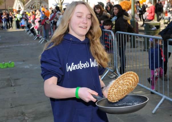 JPCT 190213 S13081159x  Horsham Rotary charity pancake races in the Carfax.   -photo by Steve Cobb