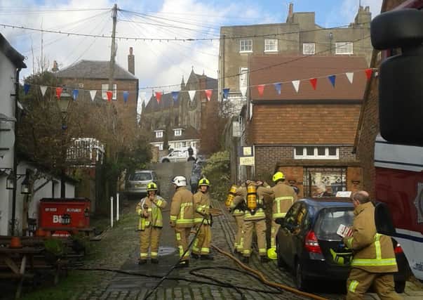 Firefighters tackle the blaze at The King's Arms pub, in Tarrant Street, Arundel