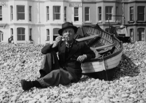 Dr Oliver Horsley Gotch on the beach at Worthing, c1950