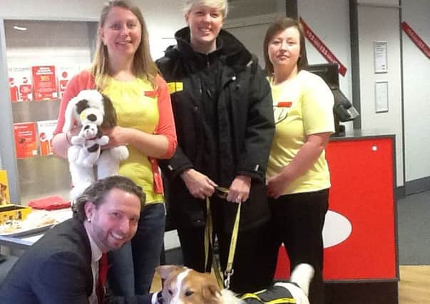 From left, mortgage adviser James Wingate, branch manager Clare Watson, Naomi Tucker from Dogs Trust and cashier Nicola Burrows
