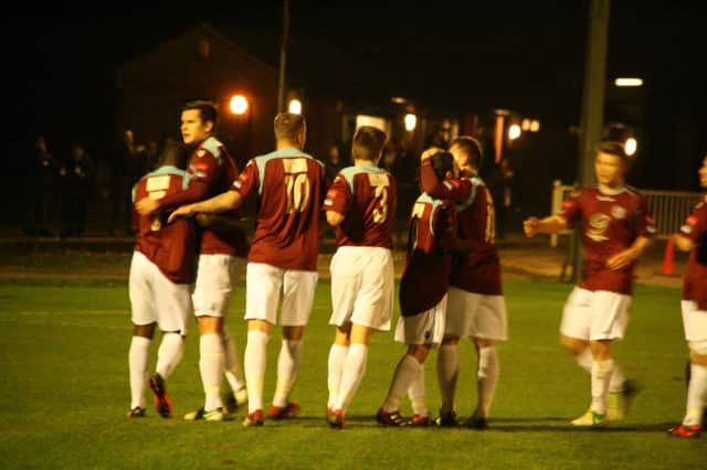 Hastings United celebrate scoring against Hythe Town on Monday night. Picture by Terry S. Blackman
