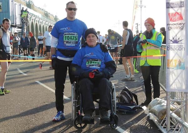Horsham Jogger Andy Spriggs who has motor neurone disease being pushed in a wheelchair by nephew Chris at the Brighton half marathon