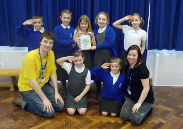 Laura Berridge, founder and Artistic Director of Arts Insight (right) and Musical Director Fergal O'Mahony (left) with pupils from Castlewood Primary School