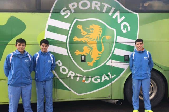 Three Buckswood Football Academy students outside the Sporting Lisbon club coach