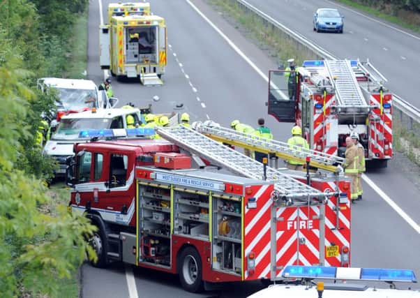 Emergency services attend two vehicle collision on A24 in 2013 -photo by Steve Cobb