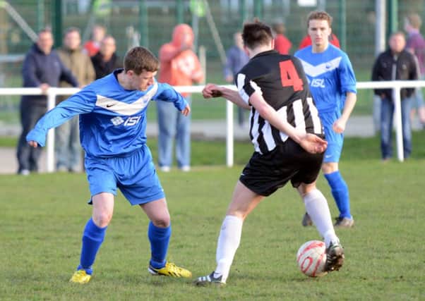Action from Storrington's draw with Wick & Barnham