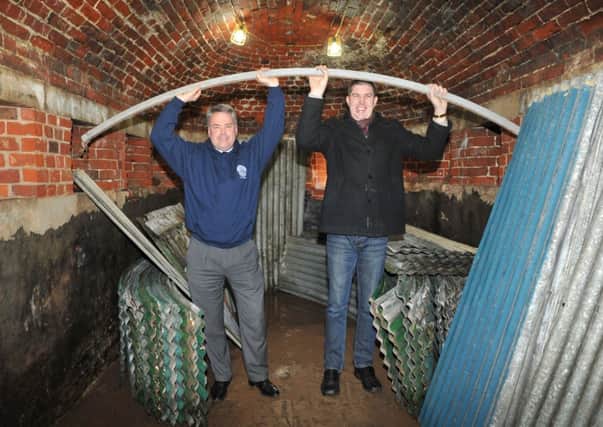 MP Tim Loughton and Gary Baines with parts of the nissen hut to be reconstructed at Shoreham Fort S08140H14