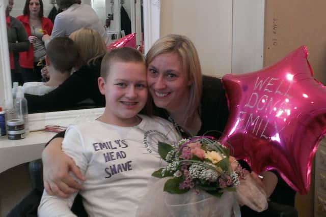 Emily Dyer, 12, with her mum Angela Frazer after her headshave for St Catherine's Hospice