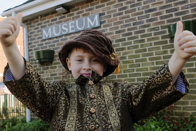 S08538H14 Laurie Williams enjoys dressing up at Steyning Museum