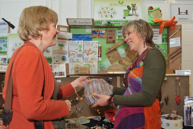 W06111H14-SpringSowSpring Sow and Grow Seed Swap. Pictured are L-R Jean Francis at Carrie Cort's Sussex Green Living stall.  Oak Grove College. Worthing.