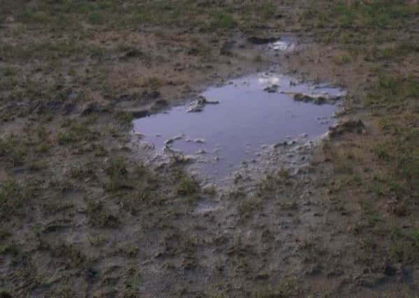 Hastings United's trip to Redhill has been put back 24 hours to tomorrow night because of a waterlogged pitch