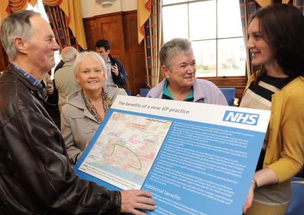L08902H14

NHS Health Exhibition at the Millennium Chamber at Littlehampton Town Council on Monday afternoon .Bussiness Manager at the Arun Medical centre Moren Bank (right) shows plans to visitors