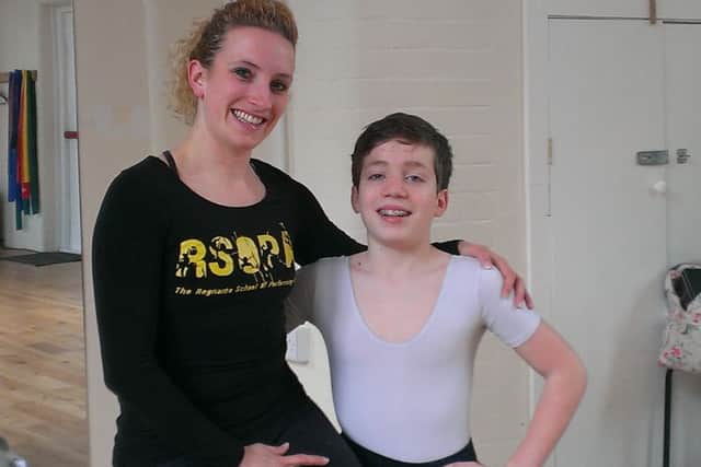 Amelia Regnante, principal of the Regnante School of Performing Arts, with 12-year-old Andrew Glick