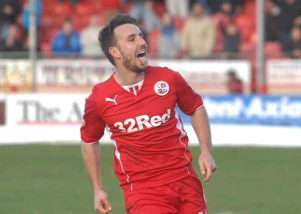 Crawley's Matt Tubbs scores from the penalty spot to win against Peterborough Utd (Pic by Jon Rigby)