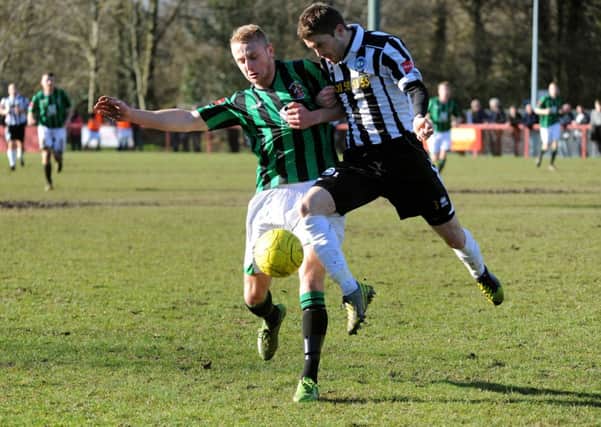 Burgess Hill (green shirt) v Peacehaven and Telscombe. Pic Steve Robards SUS-140303-104028001