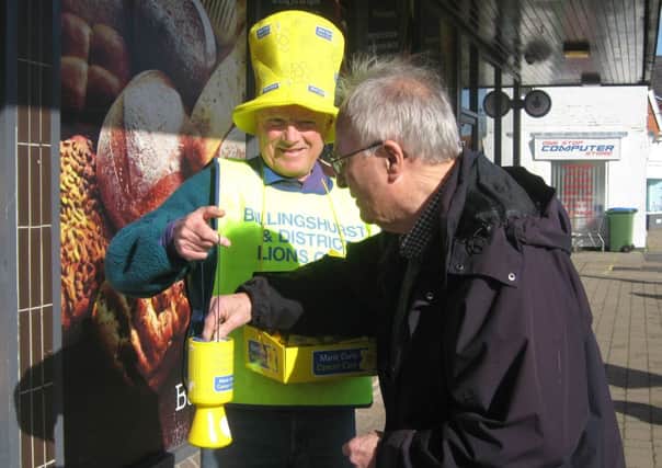 Lion Chris Davis collecting outside Budgens in Billingshurst for the Great Daffodil Appeal SUS-140303-113329001
