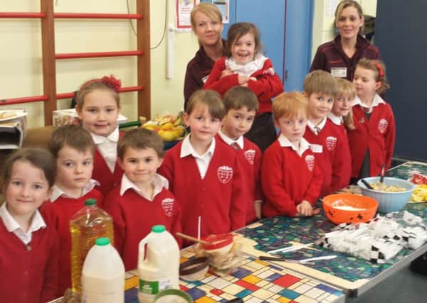 Arundel pupils celebrating Shrove Tuesday by making their own pancakes