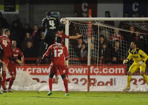 Stevenage's Bira Dembele out-jumps Mat Sadler to put them ahead (Pic by Jon Rigby)
