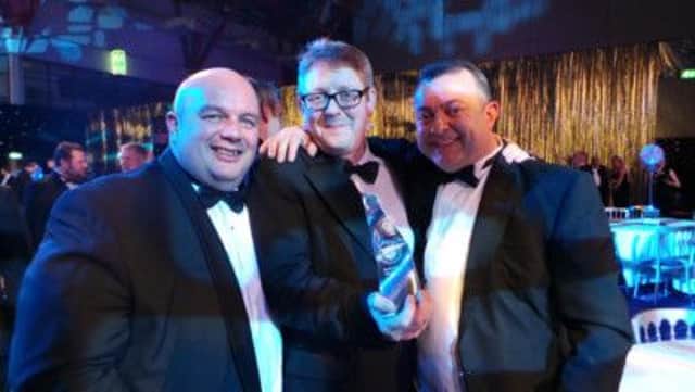Dave Wase, Julian Gamble and Lee Austin of Winner, with their events award SUS-140703-113934001
