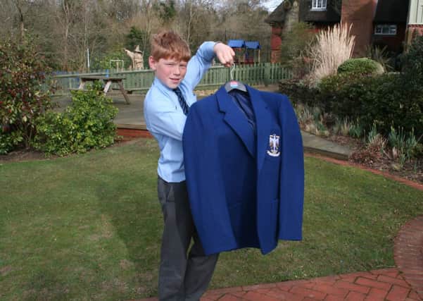 Hughie Ragg, 12, from Billingshurst  won an art and sports award to Wellington College, Berkshire, in January with the blazer on SUS-140703-155922001