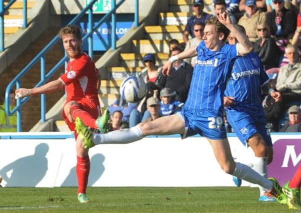 Billy Clarke shoots during the first half against Gillingham (Pic by Jonn Rigby)